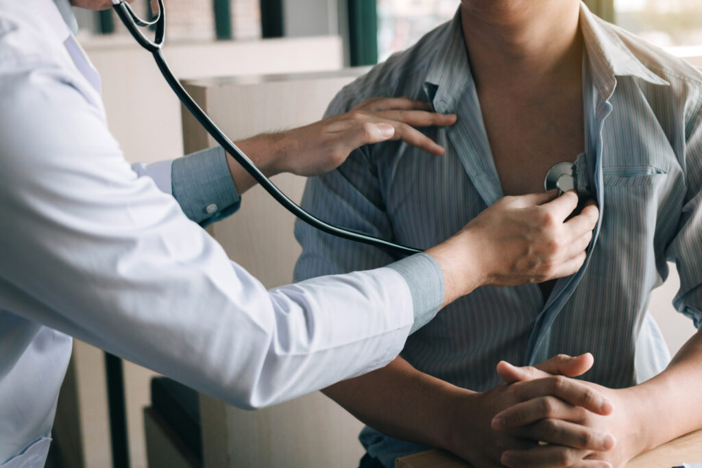 doctor using stethoscope listening heart