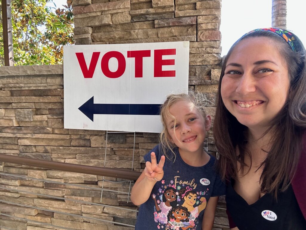 Christine and Daughter 2022 Vote Center scaled