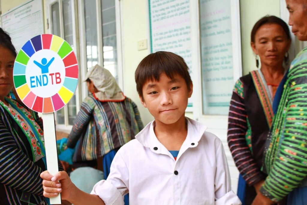 boy holding endtb sign tb tuberculosis.tmb 1200v