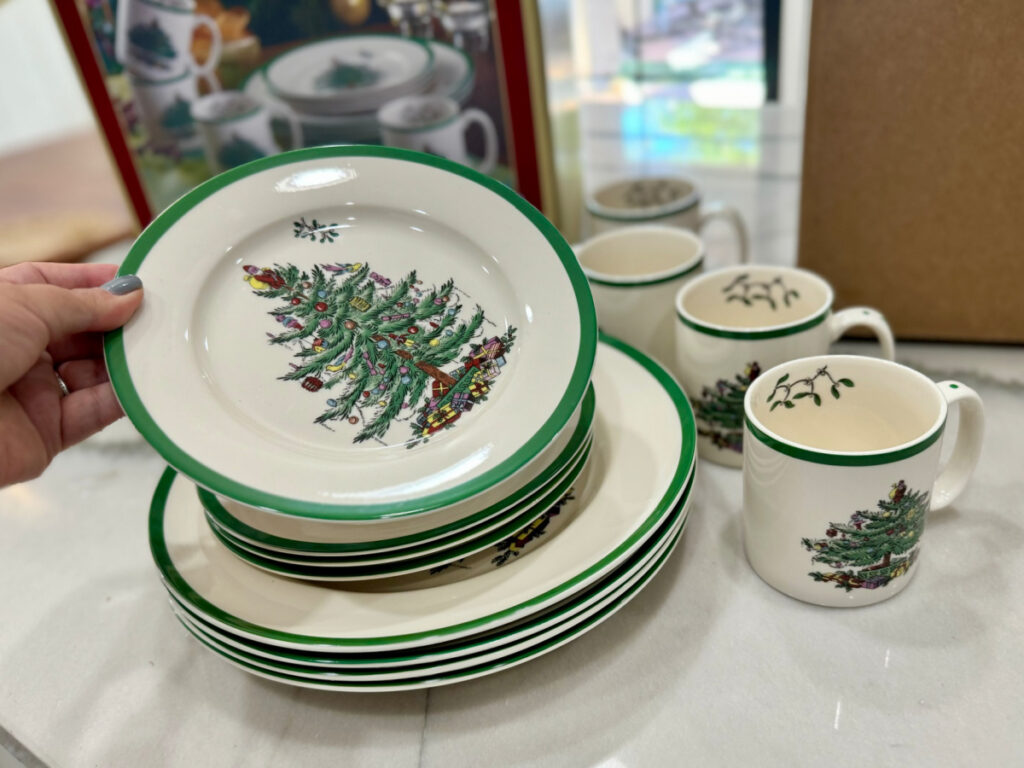 woman showing Christmas plate and cup