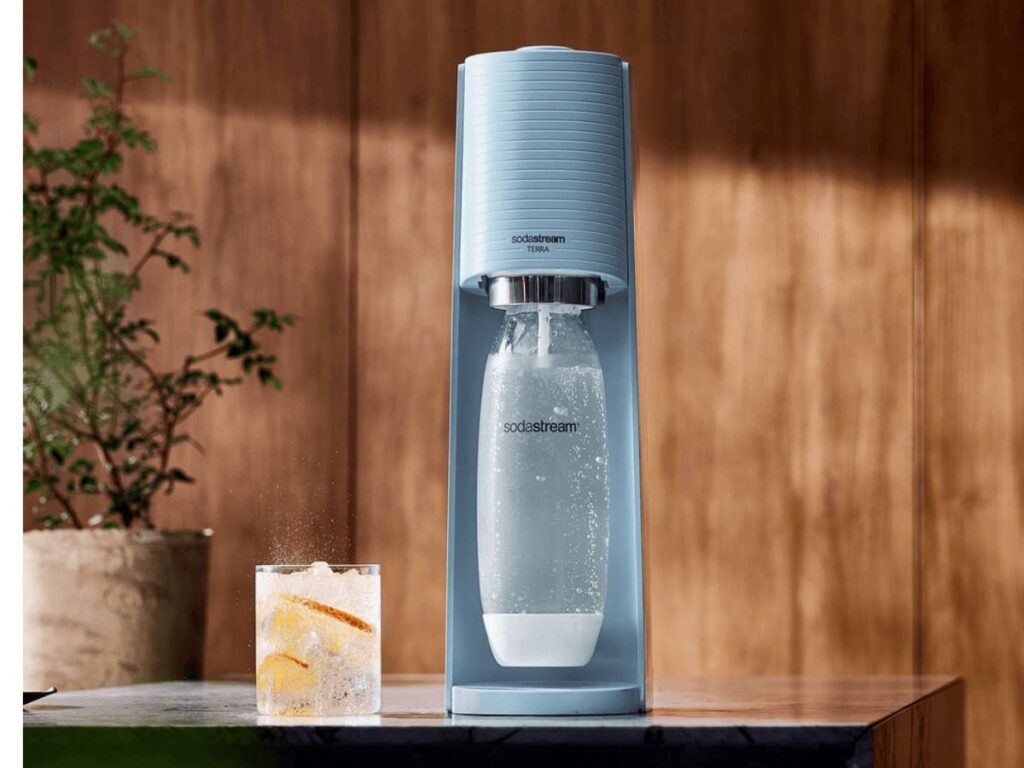 SodaStream Terra Sparkling Water Starter Kit in blue with cup next to it