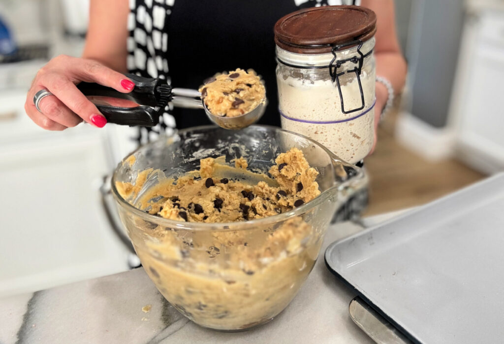 sourdough starter next to a bowl of cookie dough 1