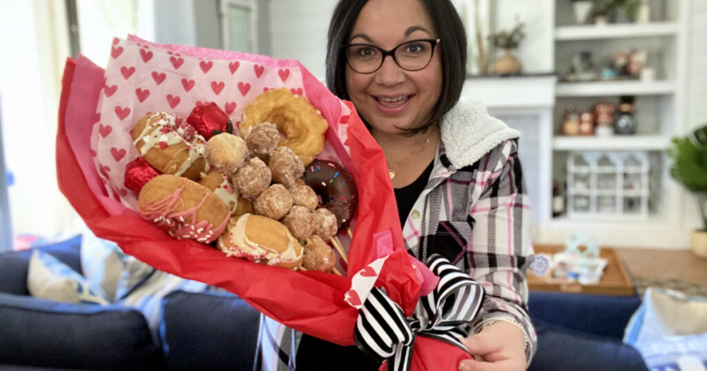 woman holding a donut bouquet 1