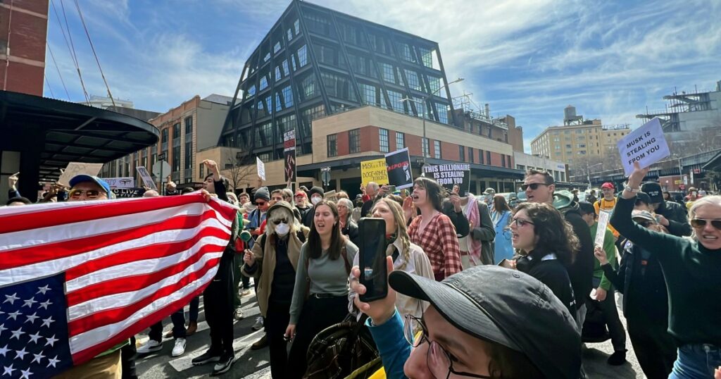 250322 protestors tesla elon musk doge wm 253p b038f7